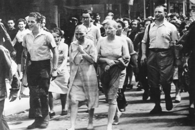 Shamed mistresses of Nazi officers being paraded through streets of Paris