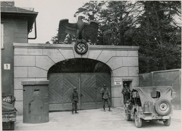 https://en.wikipedia.org/wiki/File:KZDachau1945.jpg US soldiers guarding the main entrance to Dachau after liberation in 1945