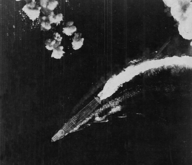 A B-17 attack misses Hiryū; this was taken between 08:00–08:30. A Shotai of three Zeros is lined up near the bridge. This was one of several combat air patrols launched during the day.