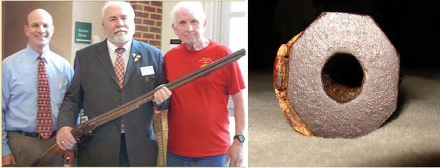 Jack Hinson's rifle, today owned Judge Ben McFarland (on the left). To the right is Lt. Col. Tom McKenny, author of two books on Hinson. The octagonal bullet on the right is one of the bullets Jack commissoned for his gun