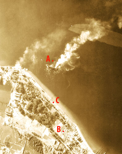 Oryoku burning after attack on 15 December 1944 about 11 AM. Photo by a Hellcat from USS Hornet (CV-12) shows POWs swimming in the water.