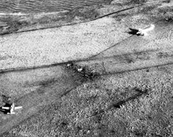Aerial reconnaissance by an RAF Harrier over Pebble Island showing a T-34 Mentor and a Pucara on the airstrip