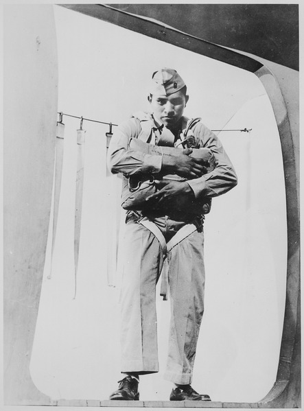 Taken on 10 November 1942, 19-year-old Hayes is about to jump from a plane at the Marine Corps Parachute School