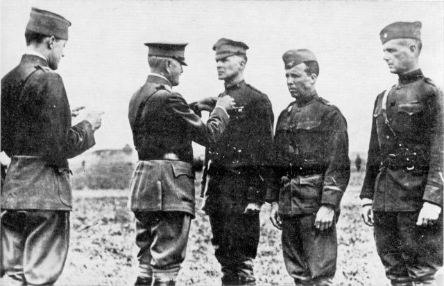 Colonel Douglas MacArthur is decorated with the Distinguished Service Cross for Bravery by General John J. Pershing