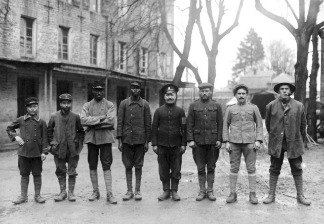 Allied POWs: a Vietnamese, Tunisian, Senegalese, Sudanese, Russian, American, Portuguese, and an Englishman in a German prison camp
