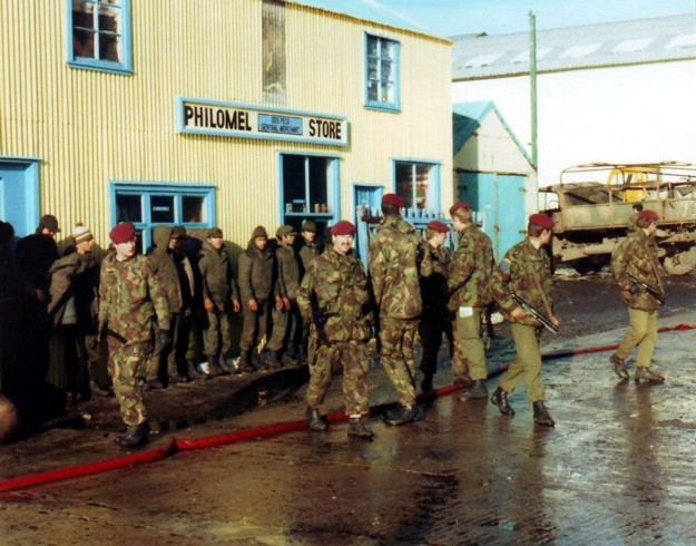 Argentine prisoners being guarded by 2 PARA. (maroon berets)