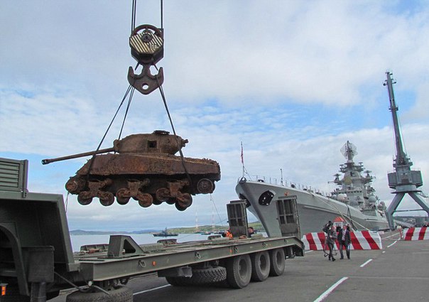 Being lifted onto a low loader for further transport.