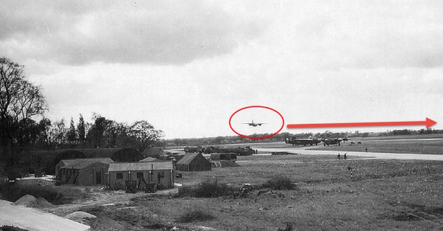 A B-26 about to buzz Lavenham. View is to the west and the buildings at left are 839th BS offices. 