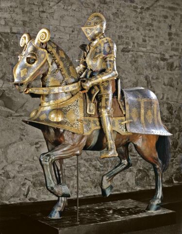 Ornate 16th-century armour for horse and knight, and typical high saddle. Royal Armoury, Stockholm (Wikipedia)
