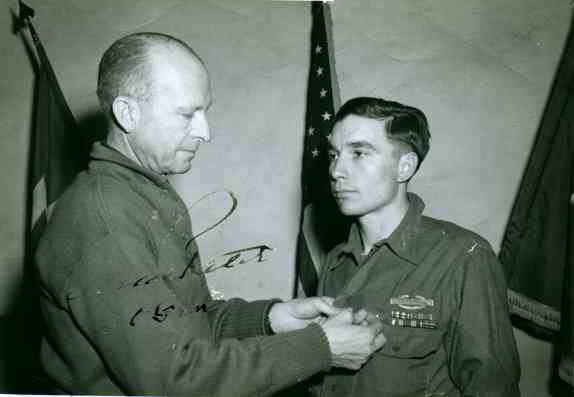 Lt. General Alexander M. Patch awards 1st Lieutenant, G. Murl Conner, the Distinguished Service Cross, Feb. 10, 1945 for extraordinary heroism in action on January 24, 1945 near Houssen, France.