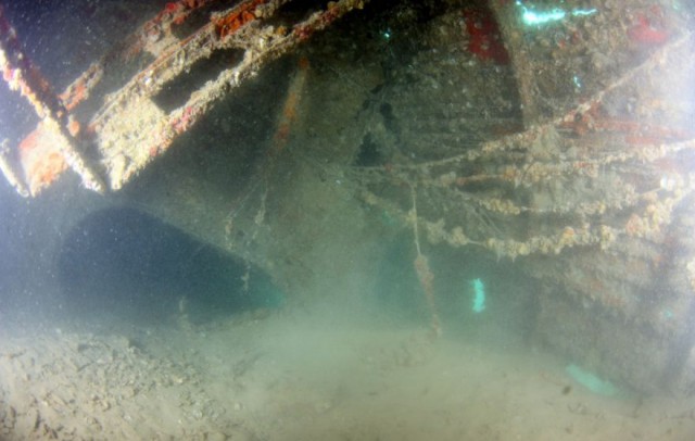 Silted interior of the fuselage in the area of the mechanic’s compartment. (Credit UH Marine Option Program)