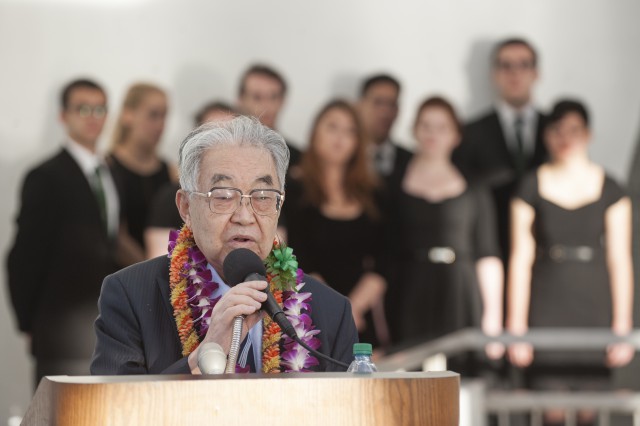 Dr. Hiroya Sugano M.D., director general of the Zero Fighter Admirers Club, speaks at a Blackened Canteen ceremony as part of the Pearl Harbor Day – 74th Commemoration Anniversary Nov. 6, 2015, at the USS Arizona Memorial, Hawaii. The Blackened Canteen ceremony is a way for Americans and Japanese veterans and observers to extend a hand of continued friendship, peace and reconciliation by pouring bourbon whiskey as an offering to the fallen in the hallowed waters of Pearl Harbor. The ceremony is co-hosted by the National Park Service and Pacific Aviation Museum Pearl Harbor and is one event taking place leading up to the 74th anniversary of Pearl Harbor Day to pay tribute to the nation’s military while enlightening Americans about veterans and service. (U.S. Air Force photo by Staff Sgt. Christopher Hubenthal)