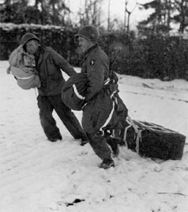 101st Airborne troops picking up air-dropped supplies during the siege.