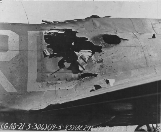http://www.thisdayinaviation.com/tag/maynard-harrison-smith/ The holes in the radio operator's compartment that Smith chucked burning debris out of