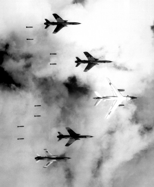 A B-66 Destroyer and F-105 Thunderchiefs release their payload of bombs over North Vietnam as part of Operation Rolling Thunder on 14 June 1966