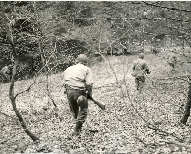 American soldiers searching for German Paratroopers dropped in the area via commons.wikimedia.org