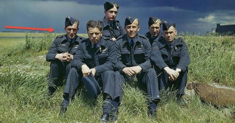  617 Squadron (Dambusters) at Scampton, Lincolnshire, 22 July 1943. Object description: The crew of Lancaster ED285/'AJ-T' sitting on the grass, posed under stormy clouds. Left to right: Sergeant G Johnson; Pilot Officer D A MacLean, navigator; Flight Lieutenant J C McCarthy, pilot; Sergeant L Eaton, gunner. In the rear are Sergeant R Batson, gunner; and Sergeant W G Ratcliffe, engineer