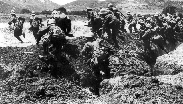  Infantry from the British Royal Naval Division in training on the Greek island of Lemnos during the Battle of Gallipoli, 1915. Men of the Royal Naval Division leaving the trenches in Gallipoli to attack the Turk with cold steel. On the extreme left the officer is seen leading the attack, while the hills in the background are typical of the difficult country to be traversed before Constantinople falls to the Allies.