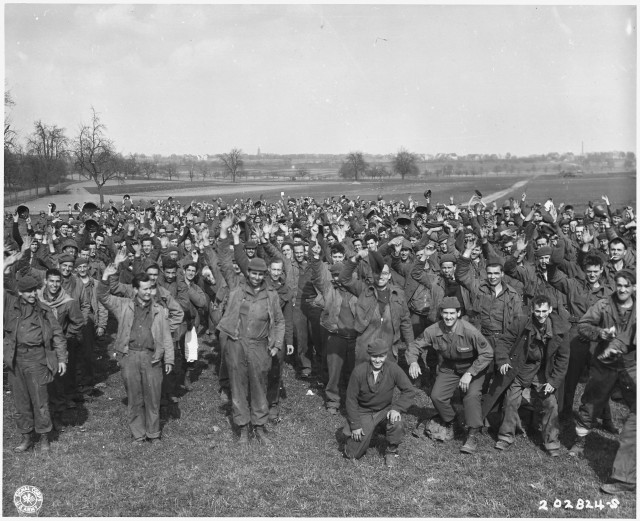 US Soldiers outside a German POW Camp via commons.wikimedia.org