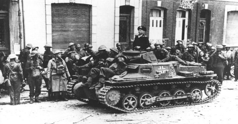 After the capture of Calais by German troops, wounded British soldiers are brought out from the old town by German tanks. By Bundesarchiv - CC BY-SA 3.0 de