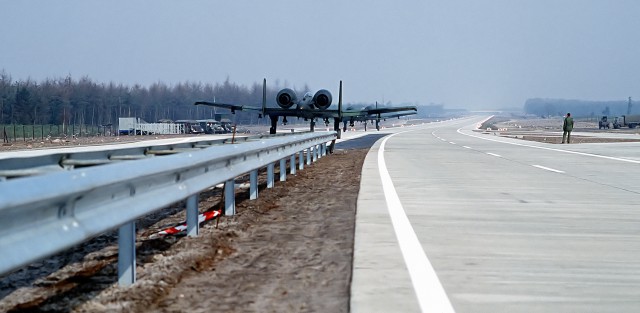 Rear view of an A-10 Thunderbolt II aircraft as it takes off from the autobahn A29 near city of Ahlhorn during NATO-exercise "Highway 84".