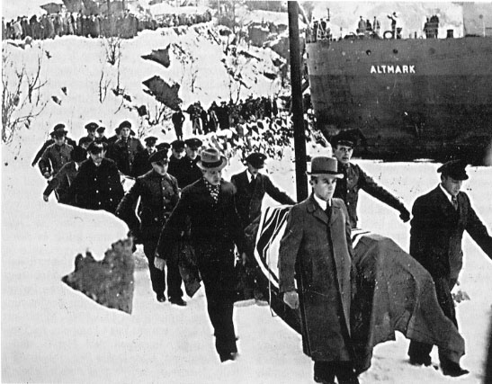 Dead German soldiers being offloaded from the Altmark on 16 February 1940 in Norway. Their coffins are draped with the flag of Nazi Germany