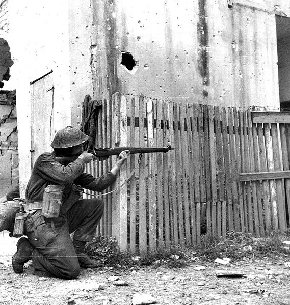 A Canadian rifleman taking aim in Ortona