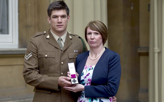 Mother of James Ashworth receiving Victoria Cross on his behalf via telegraph.co.uk