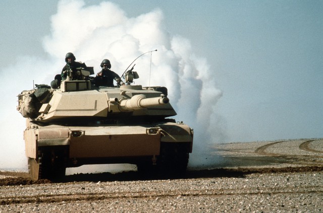 An M-1A1 Abrams main battle tank lays a smoke screen during maneuvers during Operation Desert Storm.