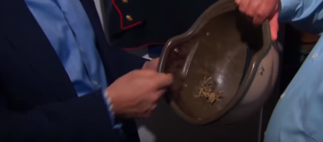 Vidaña showing Gupta the helmet he kept, complete with the bullet hole