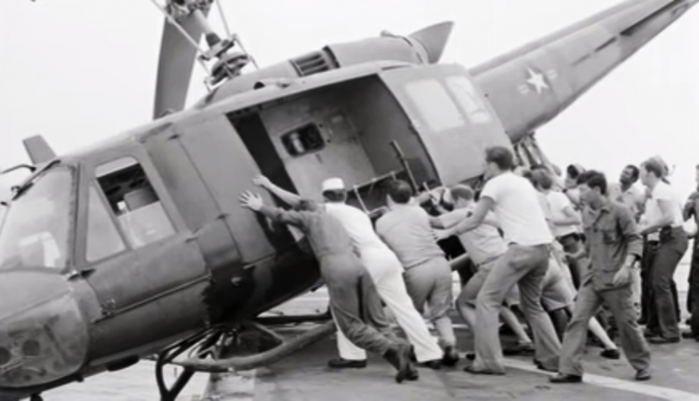 The crew of the USS Kirk pushing a chopper off of their only landing deck