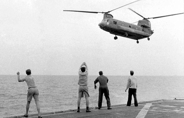 The crew of the USS Kirk waving off Nguyen's Chinook