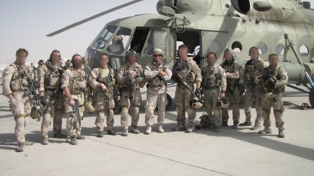 Navy SEAL team members with faces omitted.
