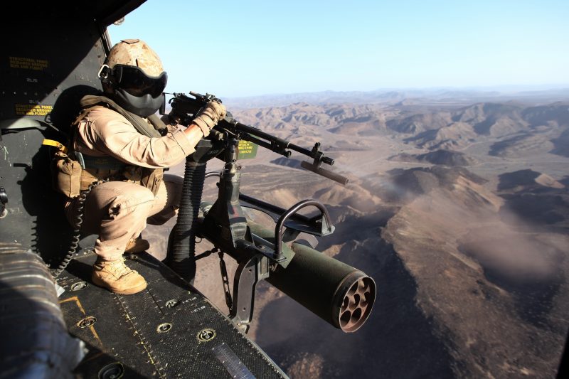 Sgt. Ryan D. Peek, a UH/AH-1 helicopter mechanic and Lubbock, Texas, native, with Marine Medium Tiltrotor Squadron 365 (Reinforced), 24th Marine Expeditionary Unit, fires a mounted M240B machine gun from a UH-1Y Huey in Djibouti, March 8, 2015. A contingent of the MEU was ashore in Djibouti conducting sustainment training to maintain proficiency at the beginning of March. The 24th MEU is embarked on the ships of the Iwo Jima Amphibious Ready Group and deployed to maintain regional security in the U.S. 5th Fleet area of operations. (U.S. Marine Corps photo by Cpl. Joey Mendez/Released)