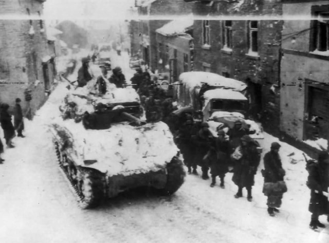 3rd_Armored_Division_M4A3E2_Sherman_Jumbo_Tank_and_83rd_Infantry_in_Lierneux_Belgium_1945