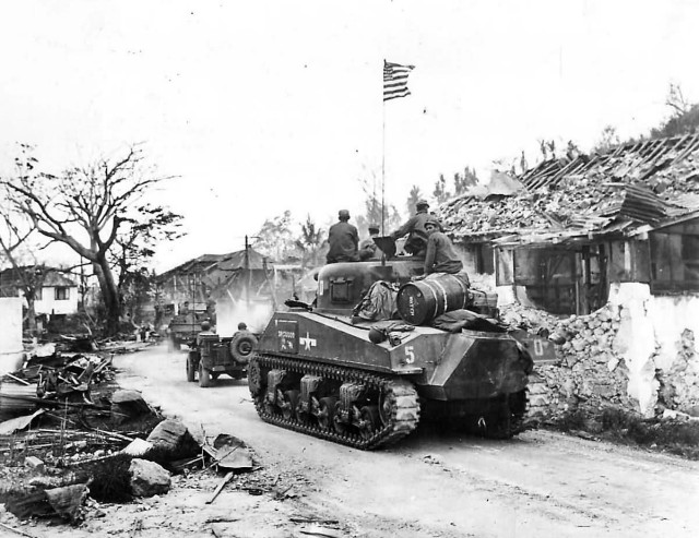 3rd_Marine_Division_Troops_and_M4_Sherman_Tank_Moves_thru_Agana_Guam