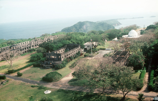 Aerial view of the ruins and a memorial to American defenders of the island during World War II.