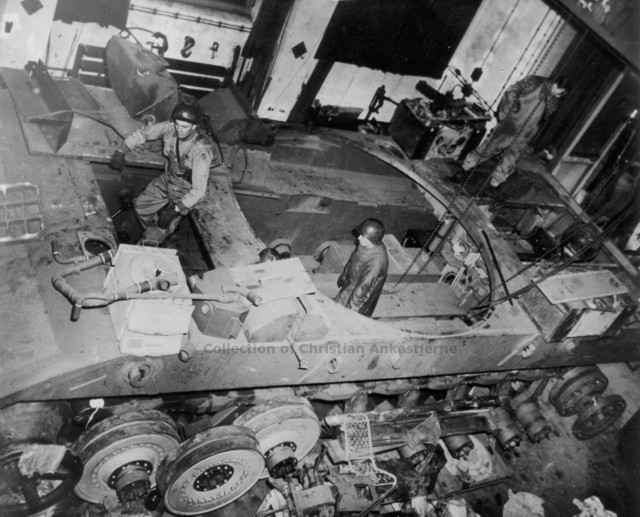 Allied soldiers inspecting the hull of the E-100 at the factory.