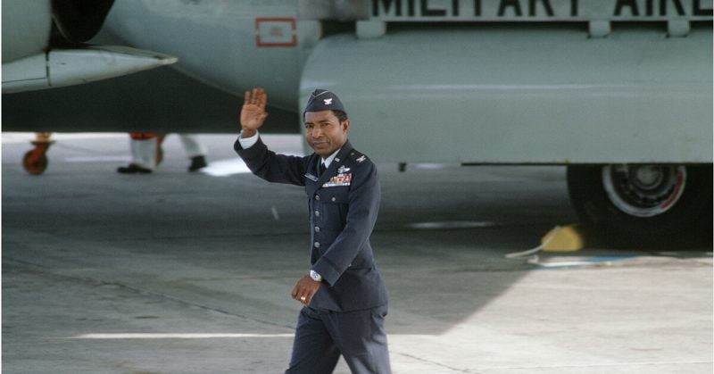 Former POW and U.S. Air Force COL Fred Vann Cherry (Captured 22 Oct 65) waves to the public and press there to greet the plane load of former POWs flown in from Clark Air Base. COL Cherry was released by the North Vietnamese in Hanoi on12 Feb 73