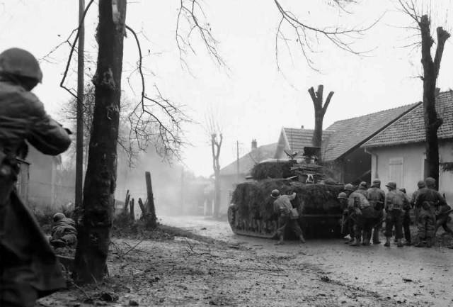 French_M4_Sherman_Advancing_with_Infantry_Belfort_20_November_1944