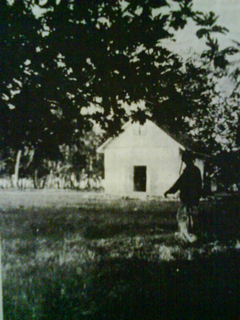 Raider Fred E. Kemp photographed near the local School House (background) near the Breadfruit Trees battlefield.