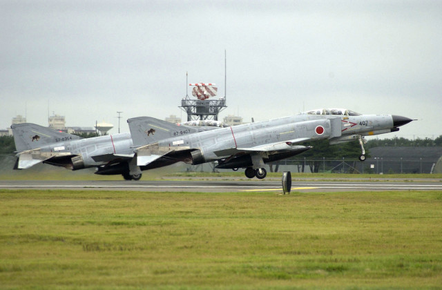 020908-N-8726C-004 Naval Air Facility Misawa, Japan (Sep. 8, 2002) -- A pair of Japanese Air Self Defense Force (JASDF) F-4 ÒPhantomsÓ take off from one of the runways on the Misawa Air Base during their annual Air Festival. U.S. Navy photo by PhotographerÕs Mate 2nd Class John Collins. (RELEASED)