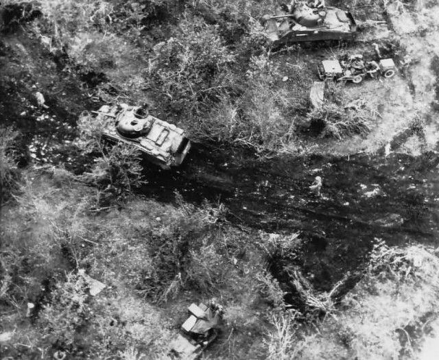 Marine_M4_Sherman_Tank_Gets_Ammo_Tinian_1944