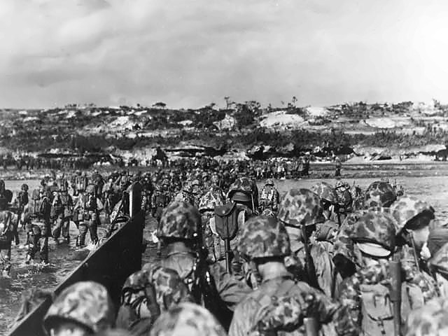  More details U.S. Marine reinforcements wade ashore to support the beachhead on Okinawa, 1 April 1945.