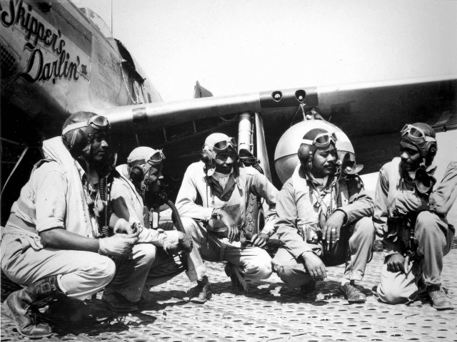 Pilots of the 332nd Fighter Group, "Tuskegee Airmen," the elite, all-African American 332nd Fighter Group at Ramitelli, Italy., from left to right, Lt. Dempsey W. Morgran, Lt. Carroll S. Woods, Lt. Robert H. Nelron, Jr., Capt. Andrew D. Turner, and Lt. Clarence P. Lester. (U.S. Air Force photo)