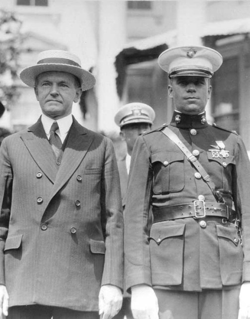Schilt receiving the Medal of Honor from President Coolidge via commons.wikimedia.org