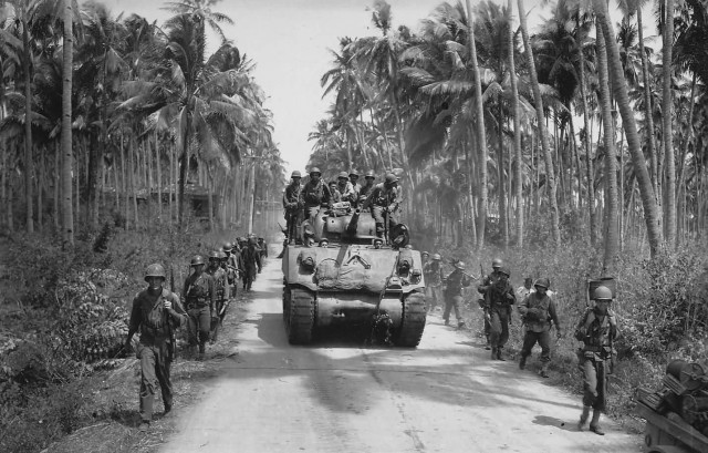 US_Army_40th_Inf_GIs_and_M4_Shermna_tank_towards_Bago_River_bridge_Negros_1945