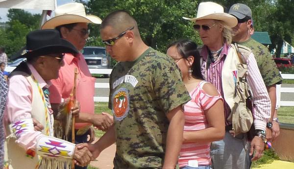 Dr. Medicine Crow (left) celebrating his 100th birthday in 2013