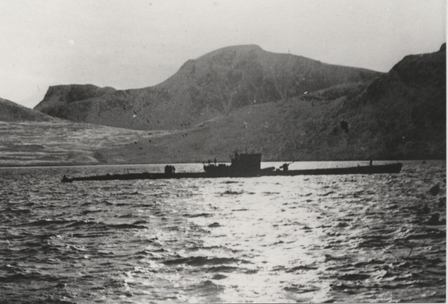 Type IXC/40 submarine U-537 at anchor in Martin Bay, Labrador, Newfoundland (now Canada) on 22 Oct 1943. Crewmen can be seen on deck offloading components of Weather Station Kurt into rubber rafts. ww2db - Bundesarchiv