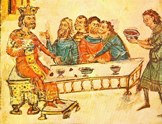 Krum, being presented with the silver-plated skull cup by the servant on the far right